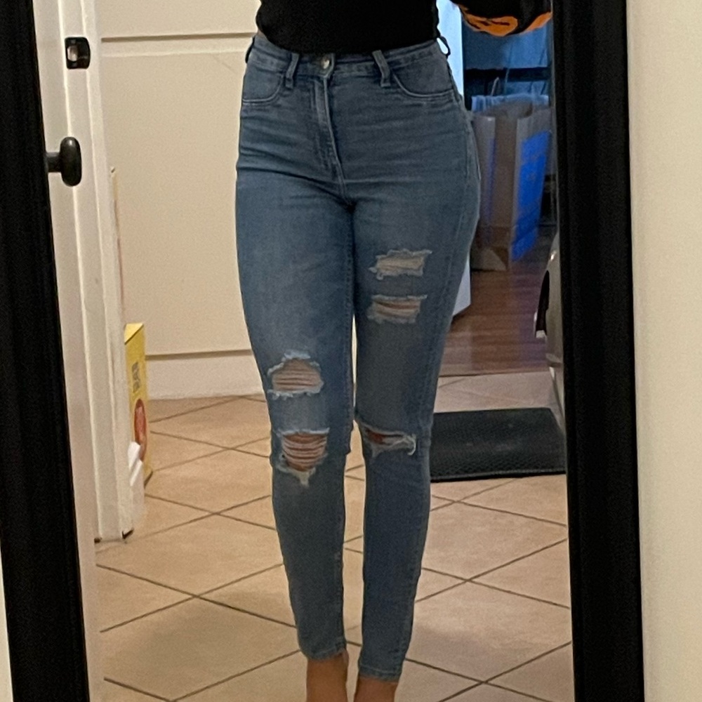High-waisted distressed skinny jeans